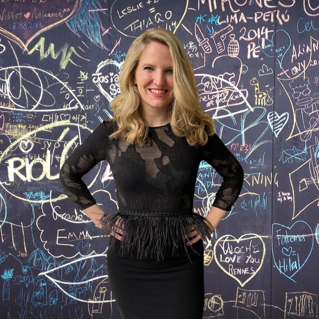 A person standing in front of a chalkboard

Description automatically generated with medium confidence